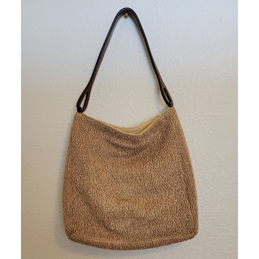 Romag made in USA basket type material with leather strap shoulder purse